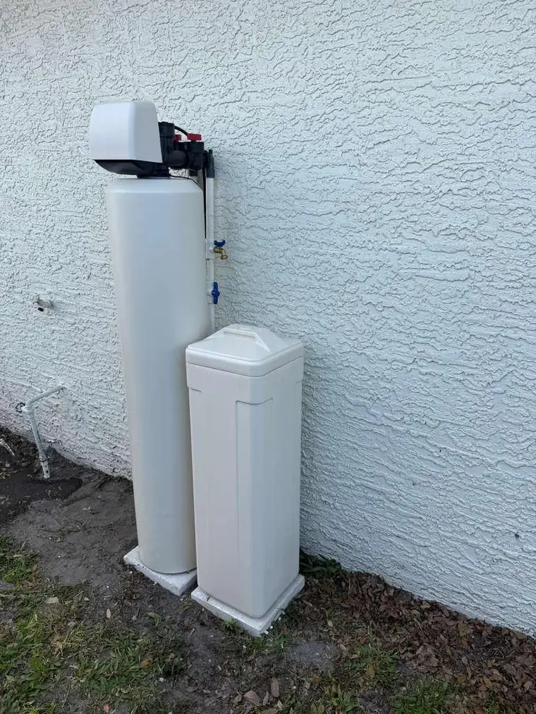 Whole-house water purification and softener system installed outdoors