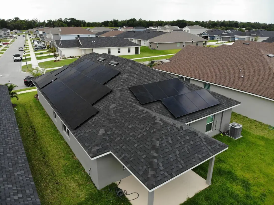 Aerial view of a home with a full array of solar panels installed by Noble Energy Solutions